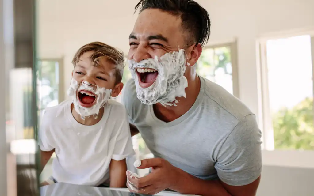 laughing-father-and-son-with-shaving-cream-on-face