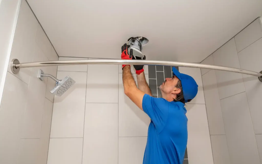 Bathroom-fitter-in-Portsmouth-installing-extractor-fan-in-bathroom