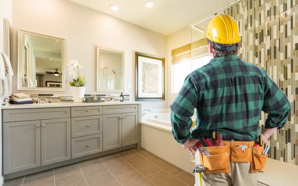 Bathroom-fitter-overlooking-completed-bathroom-renovation